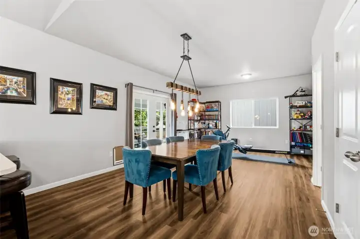 Bright dining space with direct access to the covered deck makes indoor-outdoor entertaining effortless.