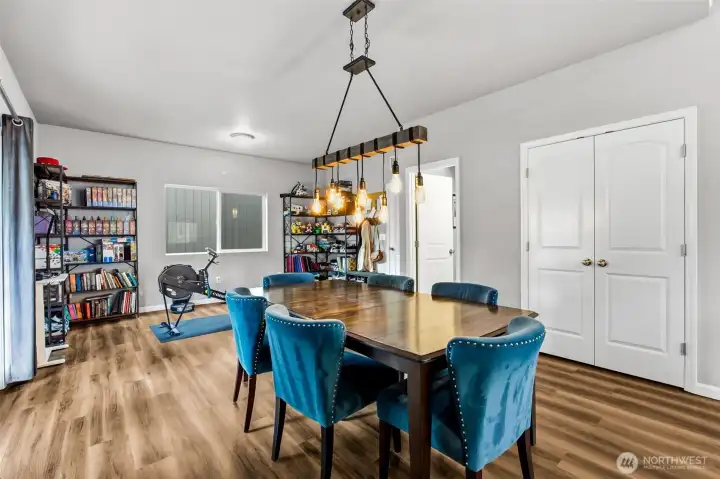 Generous dining area easily accommodates large gatherings while offering flexible space for everyday living or a home office.