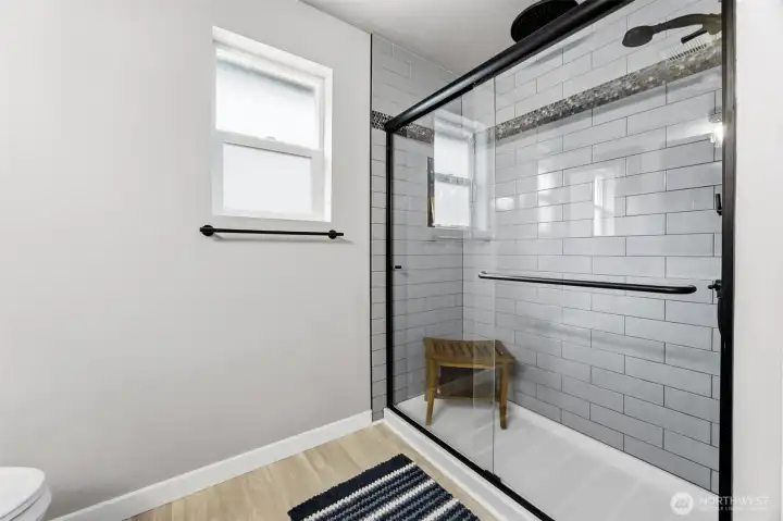 Custom-remodeled primary bath with upscale finishes, modern fixtures, and a luxurious design.