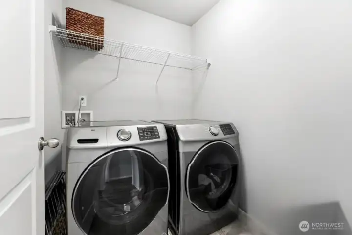 Convenient upstairs laundry room located near all bedrooms for everyday ease.