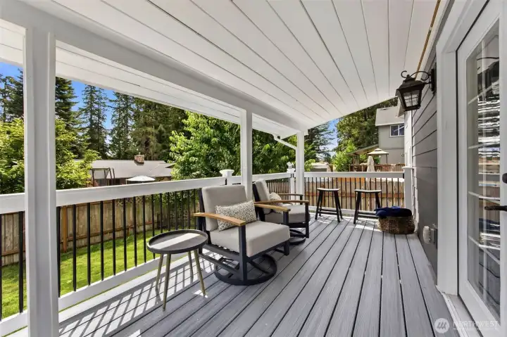 Relax year-round on the covered deck—perfect for morning coffee, outdoor dining, or evening gatherings.