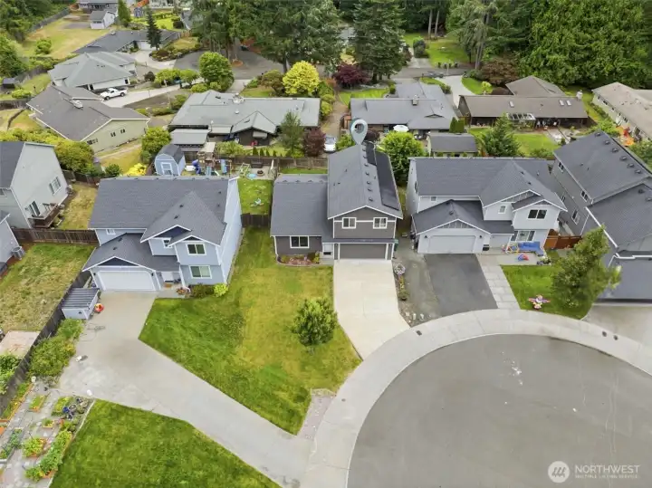 Friendly cul-de-sac setting offers minimal through traffic and a welcoming neighborhood atmosphere.