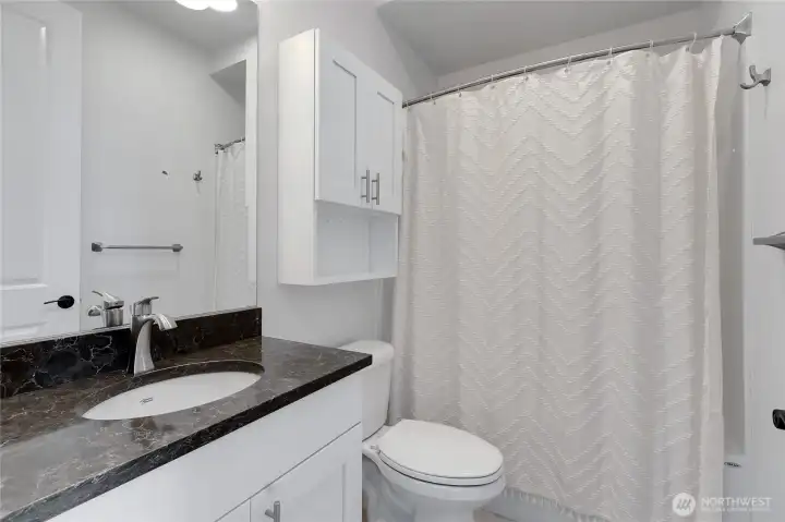 Main bath with tub/shower combo Main bath with tub/shower combo