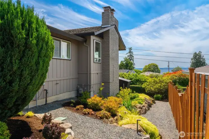 South side of the home, fully fenced with gardens. South side of the home, fully fenced with gardens.