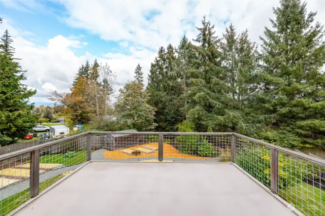 Large deck off of the dining area with stairs to the back yard