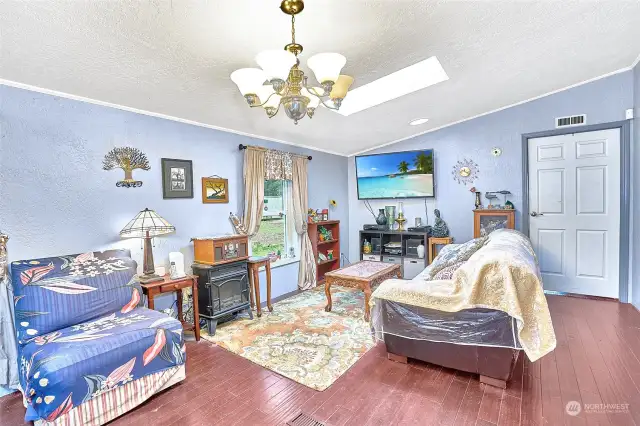 Living Room at Front of Home. Door leads to primary bedroom.