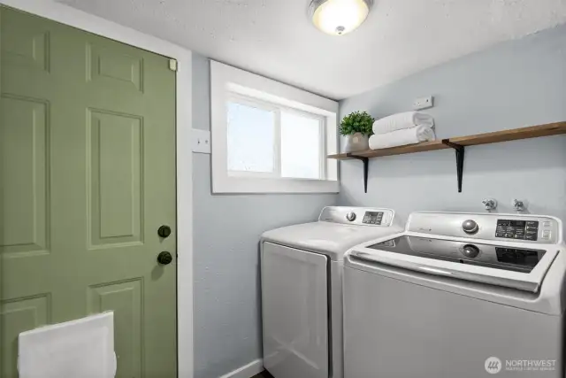 Laundry room, door leads to the backyard/deck.