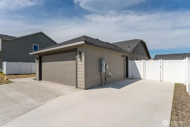 Huge extension to Driveway with Man-Door access to garage.
