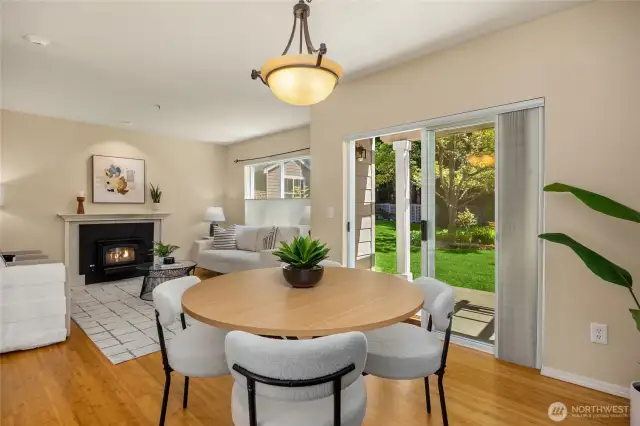 Dining room adjacent to the kitchen and living room opens through a sliding glass door to the back patio