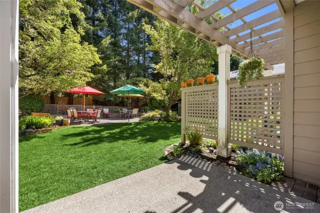 The back patio overlooks lush community space