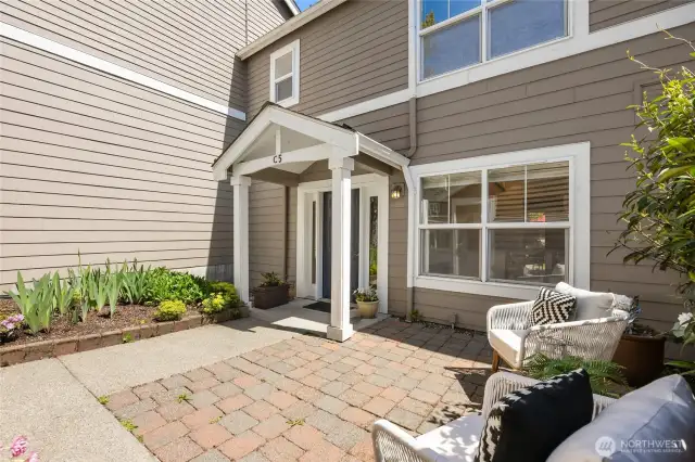 The entry has a charming patio...