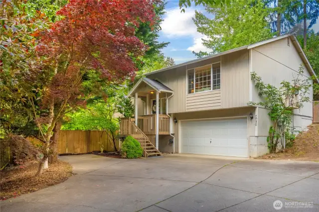 Welcome home! This adorable home in Bonney Lake (right by Lake Bonney!) is nestled off the street on a super private lot surrounded by trees!