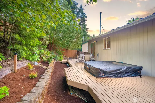 Large planter areas are terraced and can be kept as-is for low maintenance or could be planted with more landscaping to enjoy from your deck.
