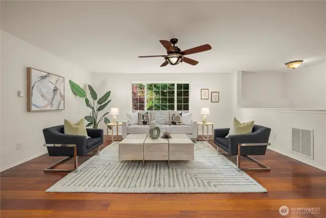 Large living room has lots of natural light and is freshly painted.