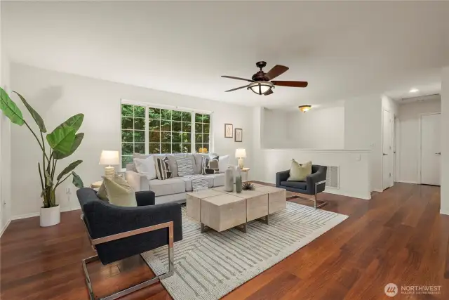 Open living space leads down the hall to the two upstairs bedroom and full bath.