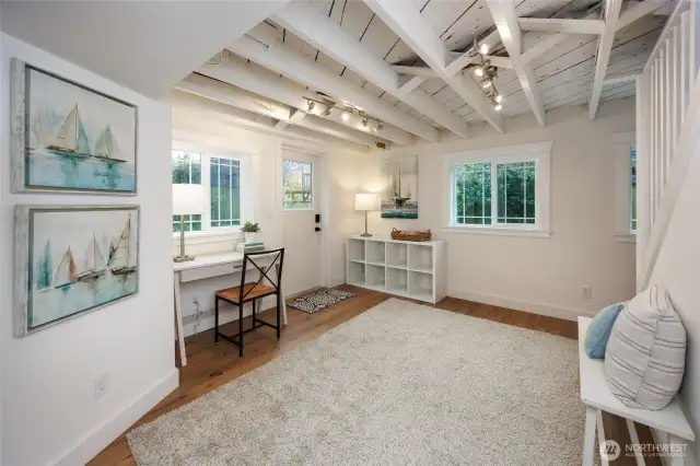 Lower level mud room comes in from backyard and garage makes great flex space.
