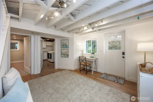 Lower level mud room comes in from backyard and garage makes great flex space.