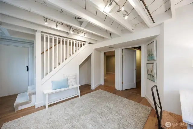 Lower level mud room comes in from backyard and garage makes great flex space.
