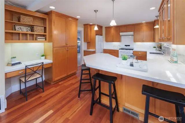 Bright and sunny kitchen with new quartz countertops, backsplash and range.