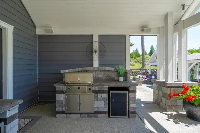 Two BBQ's - one is gas, one is charcoal.