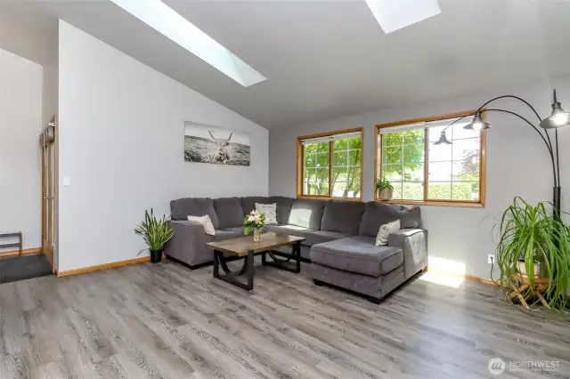 Living room with large windows to let in lots of natural light.
