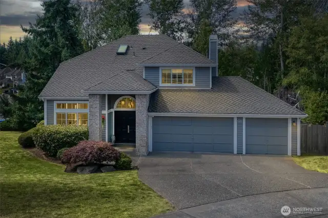 This stately Summerwind home offers timeless curb appeal with a grand entry, brick accents, and a three-car garage