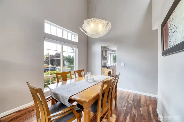 A bespoke chandelier lends sophistication to this refined formal dining space