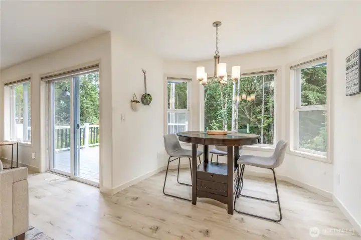 Thoughtful windows across the back of the house provide gorgeous views from all the main living areas. Concealed Hunter Douglas shades provide sun protection when needed.