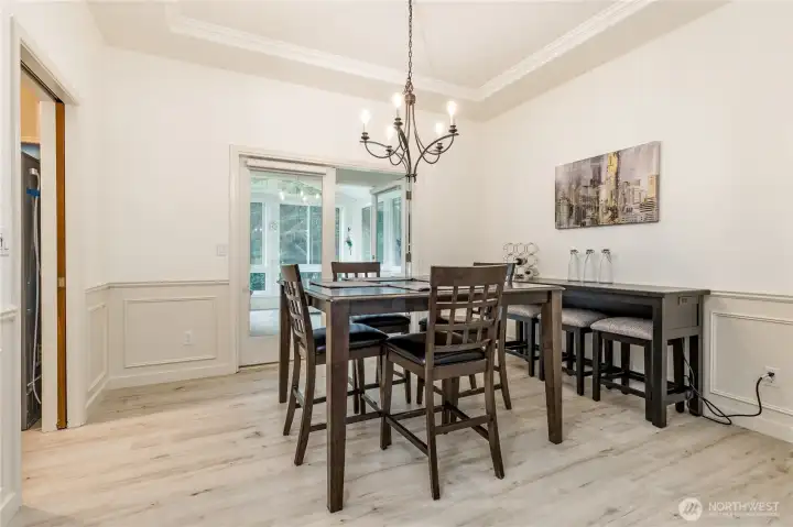 Dining room has direct access to the kitchen, sunroom and living room - perfect for entertaining!