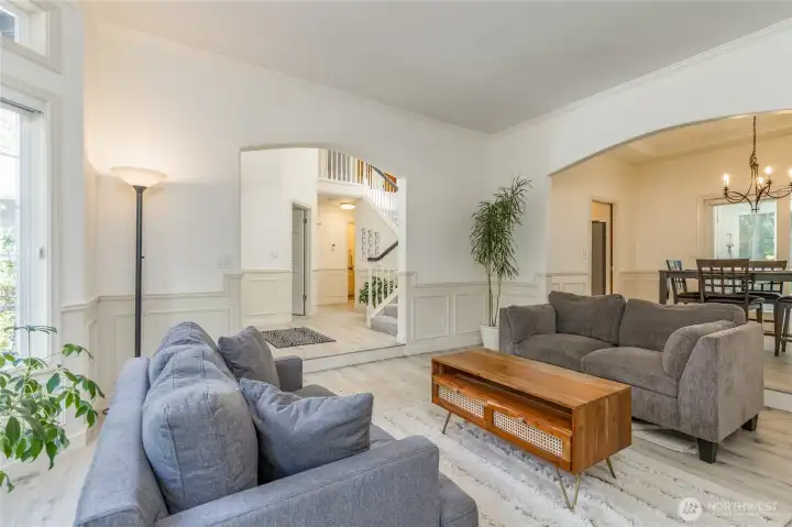 Living room just off the entry. Hybrid heating (furnace and heat pump) provide year-round comfort.