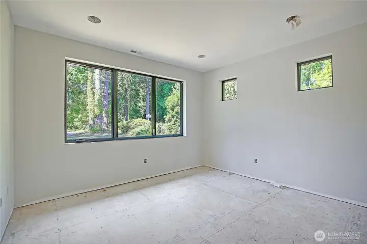 Large bedroom with spacious walk in closet.