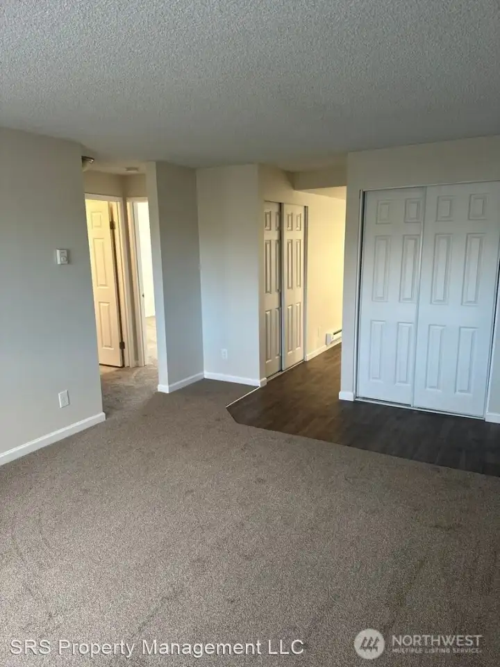 Living room towards kitchen and bedrooms