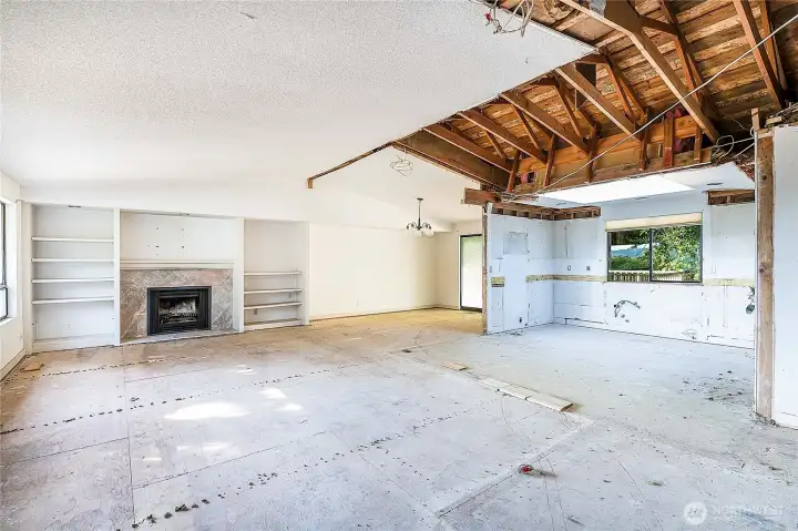Living room, dining room in the far corner and kitchen area (with skylight) just to the right of the dining room.
