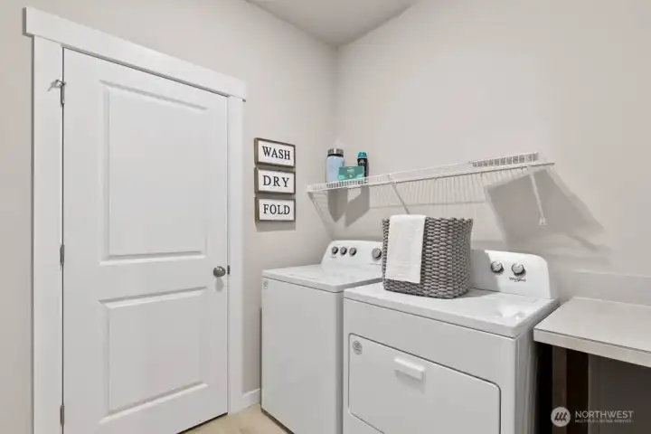 Utility room. Photo rendering is representational. Actual home is under construction and finishes, elevation, and paint colors may vary. See site agent for details.