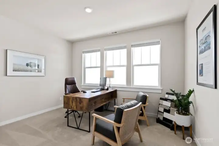 Bed 1 staged as an office. Photo rendering is representational. Actual home is under construction and finishes, elevation, and paint colors may vary. See site agent for details.