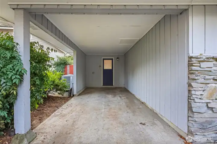 Convenient attached one-car carport with direct covered entry into the utility/laundry room, perfect for easy unloading and all-weather access