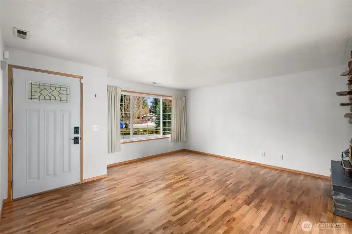 Home boasts a front door with dual entry options, including a classic keyed lock and a programmable keypad, combing modern convenience with traditional security