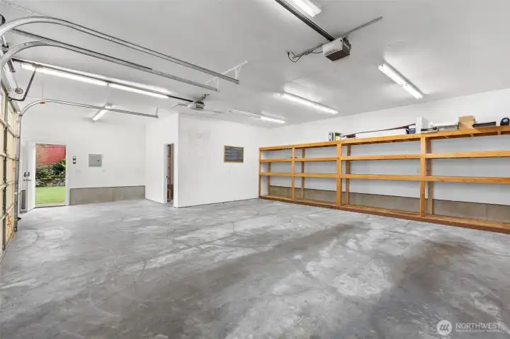 Garage equipped with water hookup capabilities, ideal for workshop use, pet washing, gardening and easy cleanup