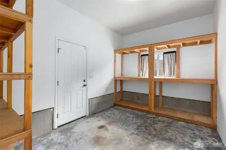 Garage includes additional room filled with natural light, perfect for crafting, woodworking, gardening prep or a bright and functional workspace