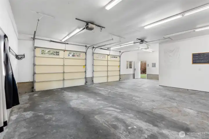 Spacious 2-car garage featuring an automatic power door, perfect for easy entry, secure parking, and modern convenience