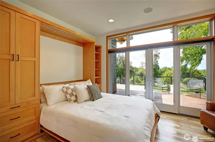 Secondary bedroom with high-end Murphy Bed and large closet plus the shelves by the bed....