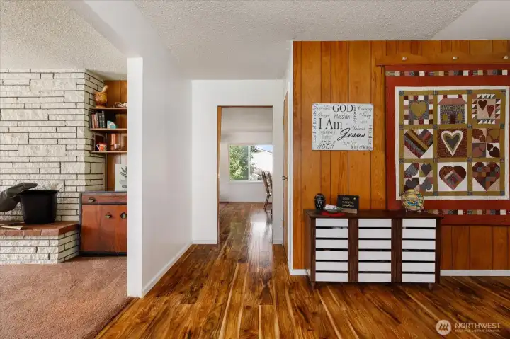 The view as you enter the home, with living room on your left and dining room/family room straight ahead. Kitchen to the right.