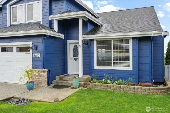 A welcoming path invites you to step inside and enjoy the views beyond.