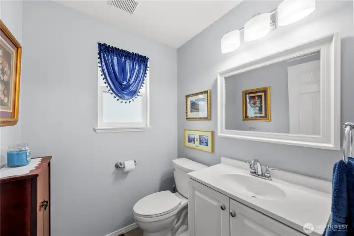 Main floor powder room perfect for guests.