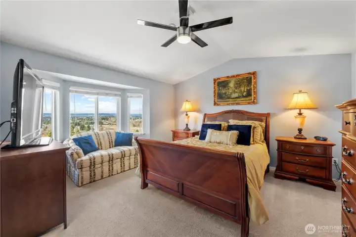 Peaceful primary bedroom retreat with beautiful panoramic views.