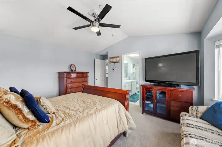 Primary suite offering comfort and beautiful natural light.