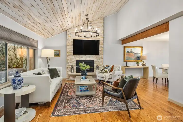 The vaulted living room space is crowned with this beautiful shiplap wood ceiling. Rich hardwood floors complete the luxury feel.
