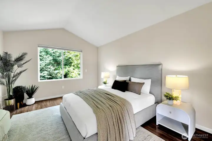 Private primary bedroom  overlooking patio below