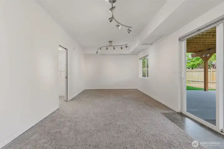 Newly remodeled bedroom in basement includes high end carpet, a huge window + a slider exiting to the newer patio. Dimmable lights, and wall reinforced with plywood ready for your big screen TV to be mounted.