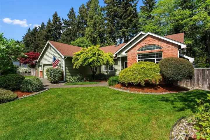 Beautiful mature landscaping. Large flat front yard.